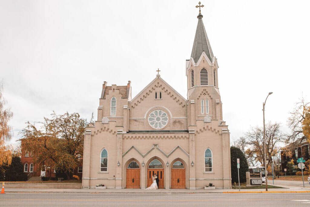 Bride and Groom outside Holy Rosary Catholic Church, Bozeman, MT.