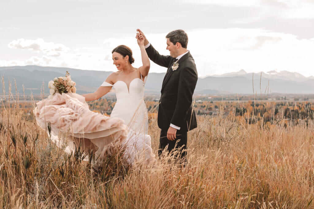 Bride and Groom dancing in field Bozeman, MT