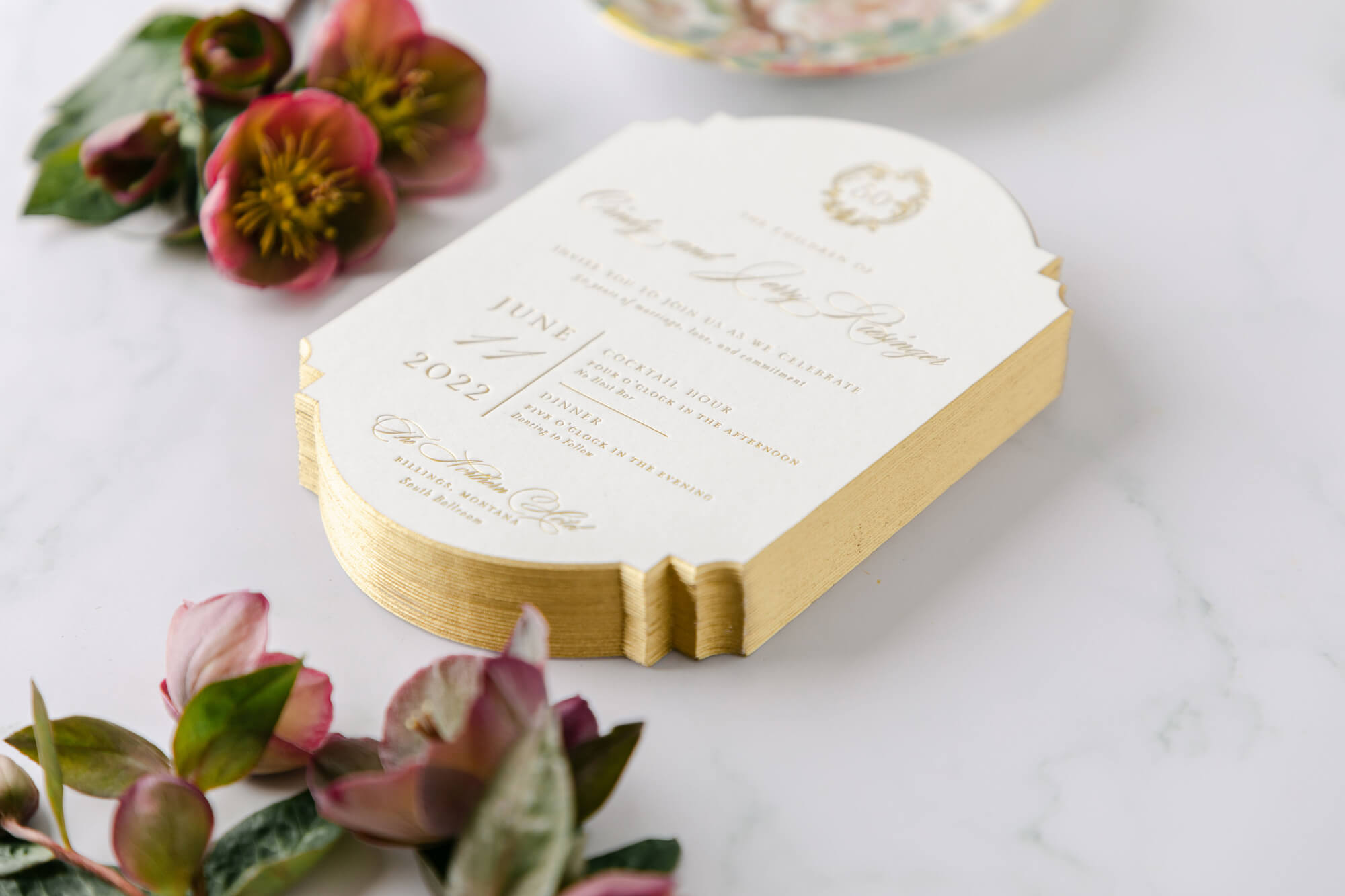 Celebrating 50 Years of Love: Our Parents' Golden Anniversary 2 Stack of custom 50th wedding anniversary invitations with gold foil edges and elegant typography