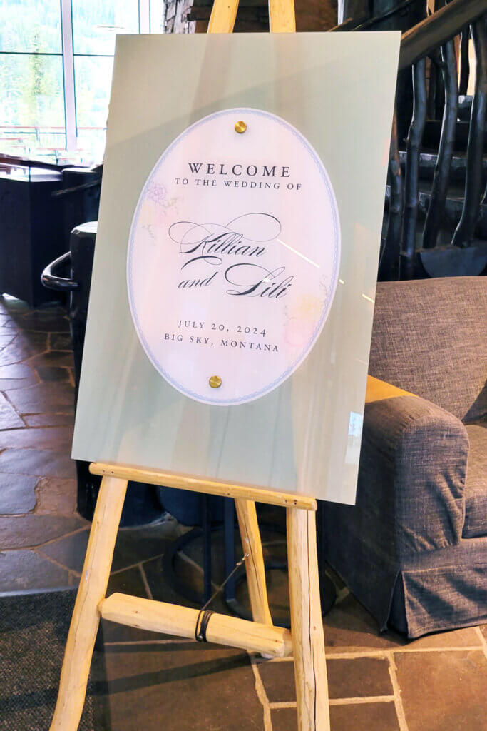 Floral acrylic welcome sign for a pastel wedding at Moonlight Basin, Big Sky, Montana.