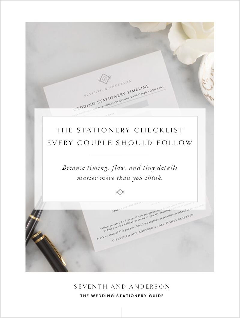 Elegant wedding stationery flat lay featuring a printed card titled “The Stationery Checklist Every Couple Should Follow” on a marble surface with a pen and soft floral accents.