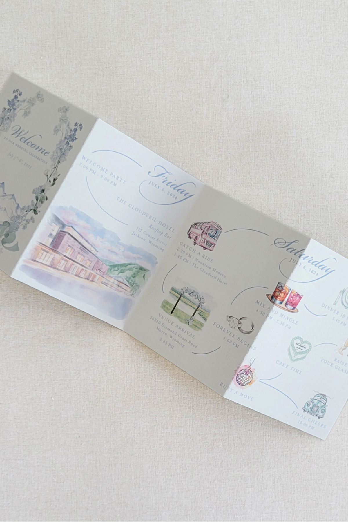 Choosing Your Wedding Invitation Style 14 Accordion-style wedding itinerary with illustrated icons and timeline details, laid open on fabric, showing a playful yet elegant wedding invitatin style.